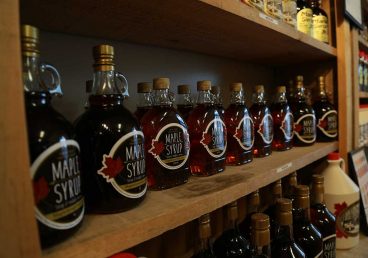 A shelf full of maple syrup